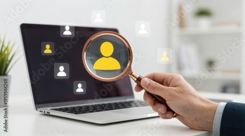 Search for profiles on a laptop screen with a hand holding a magnifying glass