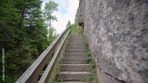 Walking up Menzenschwander Waterfall cascade stairs in Black Forest Mountain Range Germany Schwarzwald