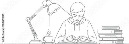 Young student focused intently on reading an open book while studying late at night illuminated by an adjustable desk lamp