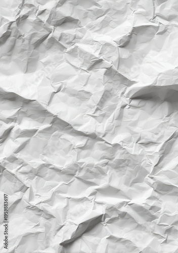 A close-up view depicts a crumpled, textured surface. The white material exhibits folds, shadows, and varying light reflection