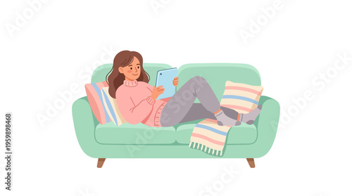 Young woman relaxing on a comfortable sofa using a tablet device.