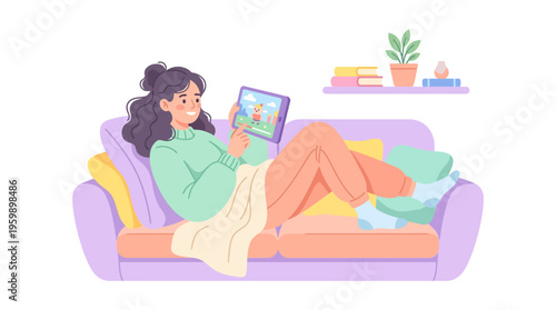 Young woman relaxing on a couch using a tablet device.