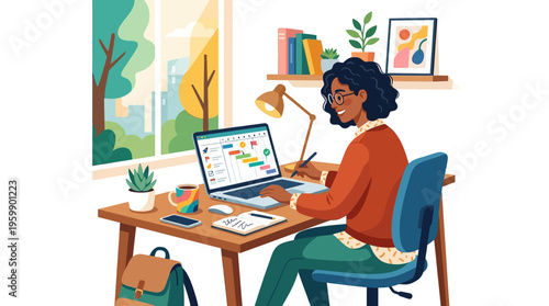 Young woman working diligently at her desk with a laptop.