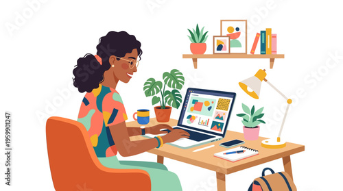 Young woman working diligently on her laptop at a desk.