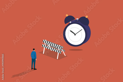 Businessman walking toward a giant alarm clock behind a road barrier, representing time management, project deadlines, and overcoming delays