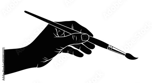 A hand delicately holding a paintbrush presented as a striking silhouette