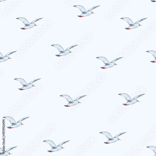 Hand painted watercolor seamless pattern featuring many seagulls flying on a light blue background creating a simple, calming nautical sea theme with repeated elements.