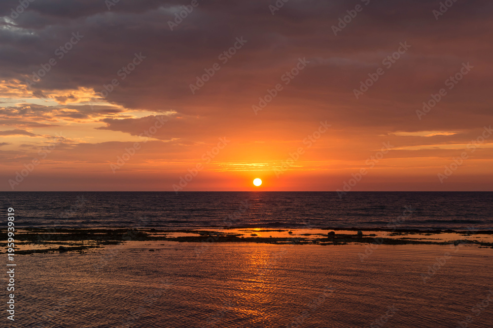 Fototapeta premium Golden sunset in Caboangan Beach in Pangasinan, Philippines.