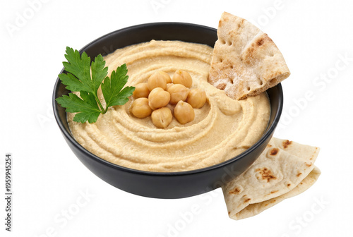 Fotografie Creamy hummus garnished with chickpeas and parsley served with pita bread in a d