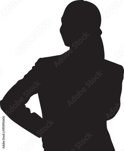 Silhouette of a woman with her hand on her hip standing confidently