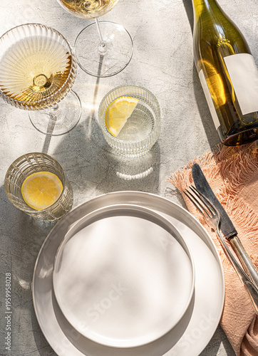 Table setting elegant and  romantic. Wine, two plates and glasses, linen napkins. top view.