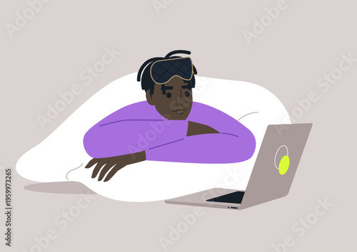 A person lounges on a soft bed, wrapped in a blanket, focused on the laptop screen. The cozy atmosphere captures a perfect blend of relaxation and digital engagement.