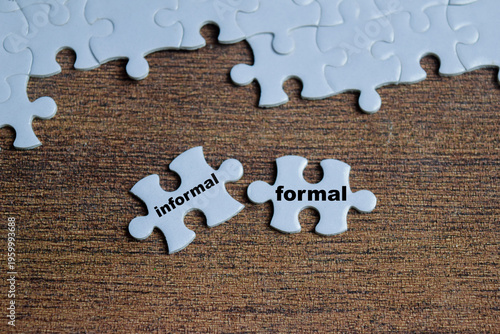 Piece of jigsaw puzzle with word informal and formal