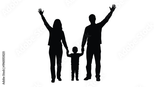 A family of three standing together with arms raised