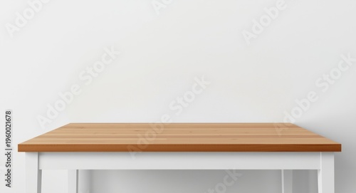Minimalist white table featuring a smooth warm wood surface against a plain white wall