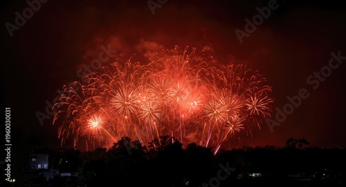 boisterous pyrotechnics lighting a gloomy nighttime backdrop