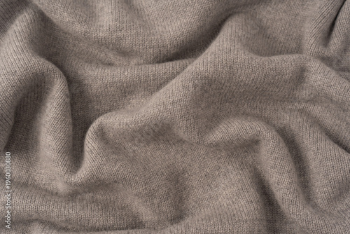 Soft grey merino wool sweater texture as a background.