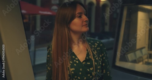 beautiful young slender woman with pleasant appearance in long dress in subway train while moving. natural Ukrainian European female beauty. German public transport Metro train tram. woman face close 