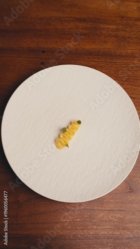 timelapse dishes of haute cuisine presentation serving details in dishes. chef hands put flowers ice cream on plate. close up plate in restaurant. food in Michelin restaurant modern cooking technology