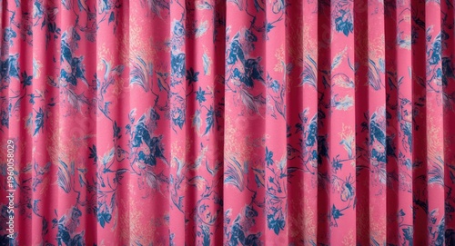 Detailed pink curtain fabric with electric blue and peach motifs as event backdrop