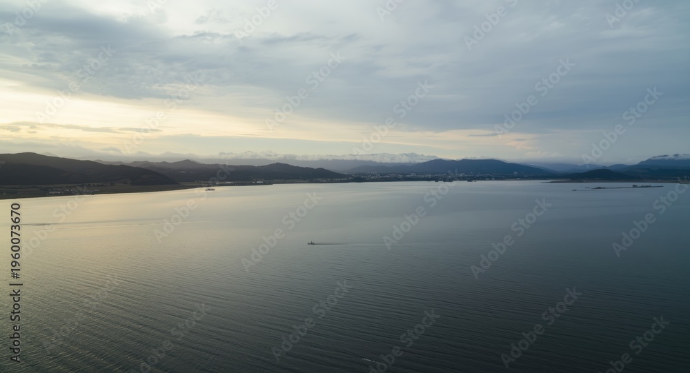 Fototapeta premium Large water expanse captured in a wide panoramic landscape view