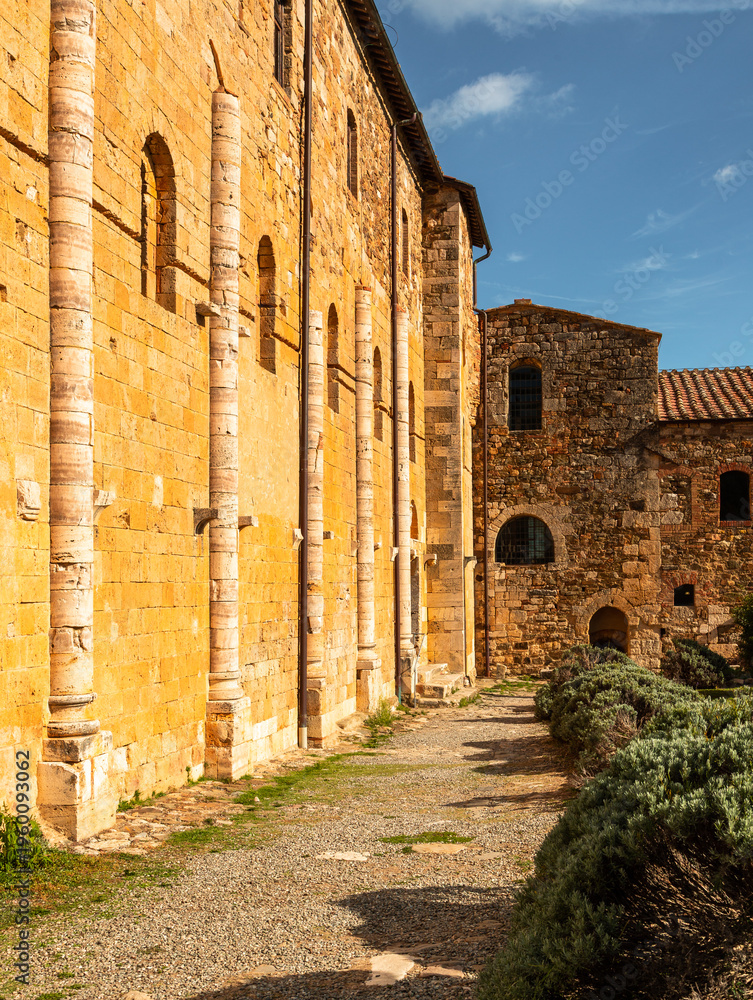 Naklejka premium Ancient stone medieval architecture at Sant'Antimo in Montalcino, Italy.