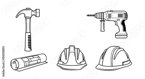 Construction tools and safety gear on a work site with hammer and drill