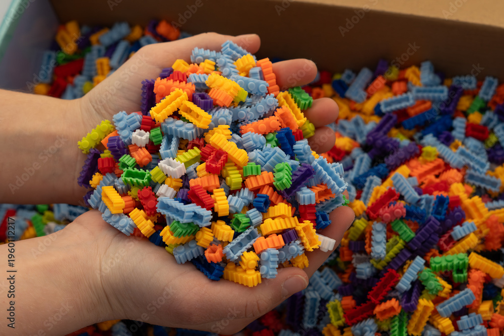 Obraz premium Multi-colored small LEGO construction pieces.