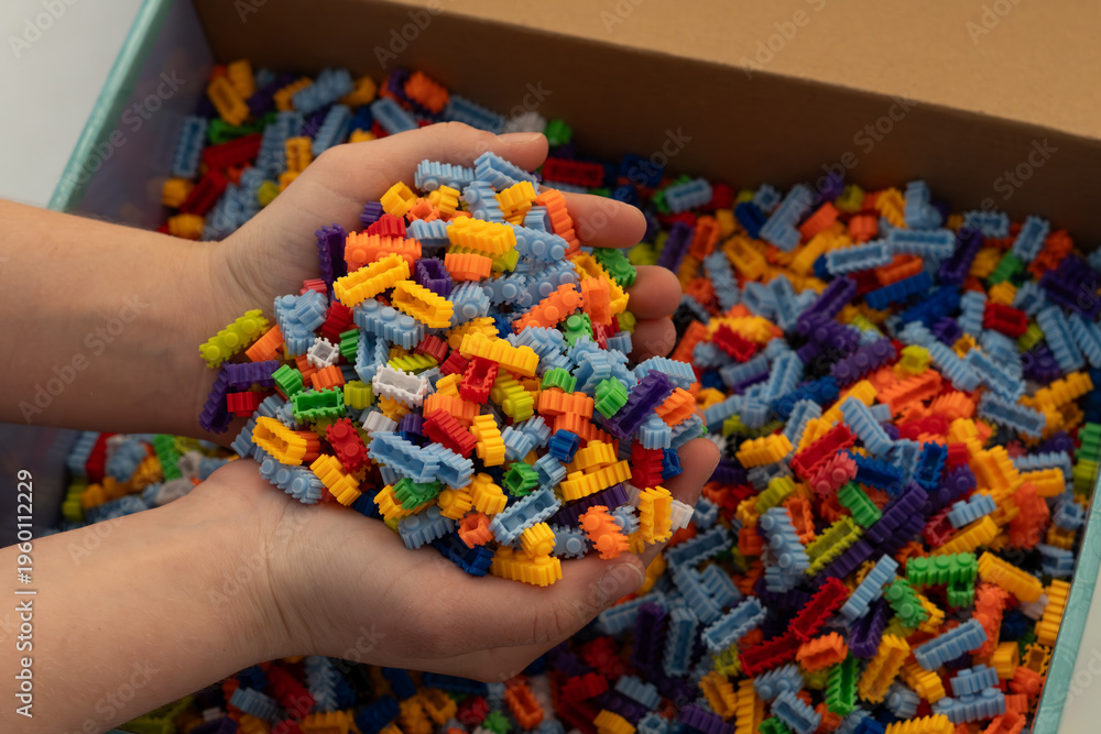 Obraz premium Multi-colored small LEGO construction pieces.