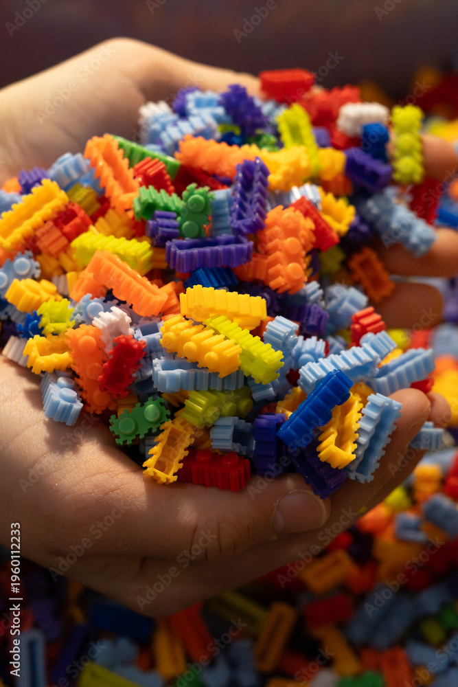 Obraz premium Multi-colored small LEGO construction pieces.