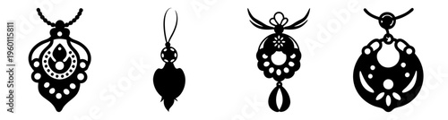 Elegant black and silver gemstone jewelry set with teardrop pendants and ornate filigree designs isolated on white background