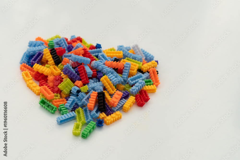 Obraz premium Multi-colored small LEGO construction pieces.