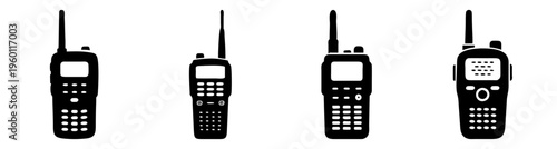 Set of four black walkie talkies isolated on white background for communication and emergency use