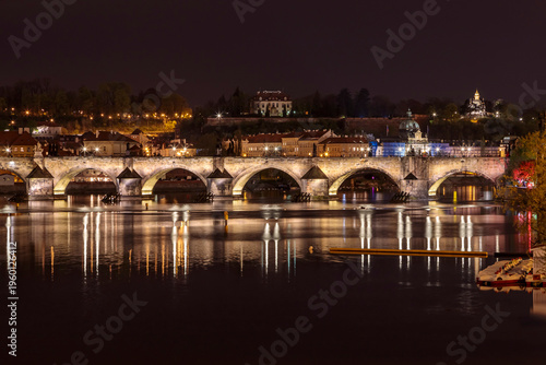 Εκτύπωση καμβά Charles Bridge in Prague in the evening with colorful lights from lanterns