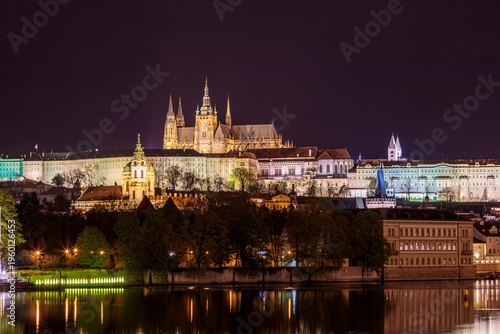 Fotografi Charles Bridge in Prague in the evening with colorful lights from lanterns