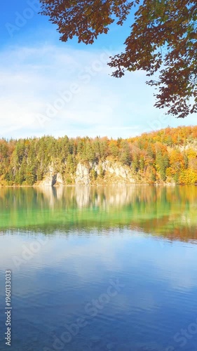 Quiet mountain stream flowing into alpine lake