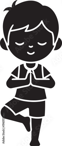 Young boy practices tree pose meditation for inner peace.
