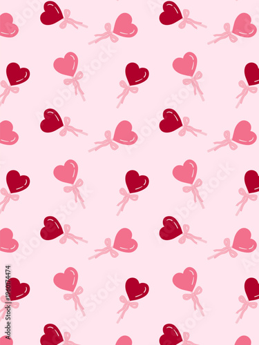 Seamless repeating pattern of pink and red heart shapes with ribbon bows on a light background. Cute romantic design with hand-drawn style hearts
