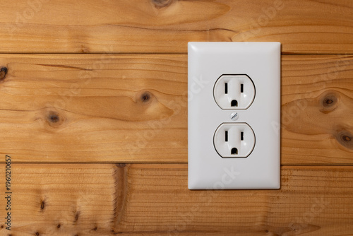 Electrical Outlet On A Wood Wall