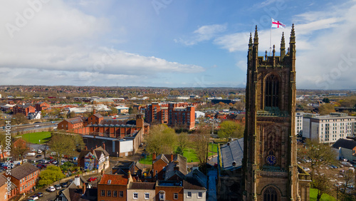 Historic Derby Cathedral tower with Saint George flag in city center