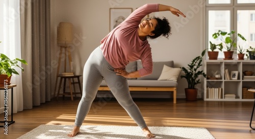 A woman practices yoga in a serene and modern living room with plants and natural light
