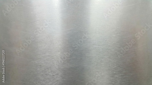 Brushed metal texture in silver with linear scratches, clean industrial surface.