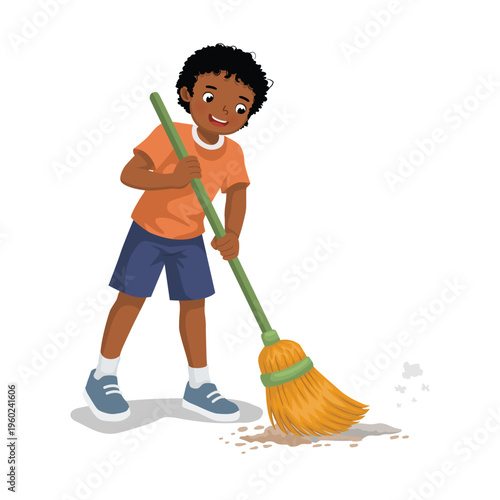 Little African boy sweeping the floor with a broom
