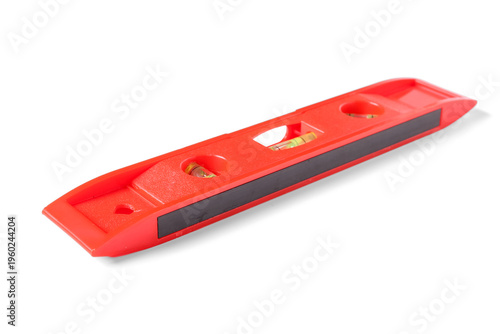 Red spirit level on white b...
