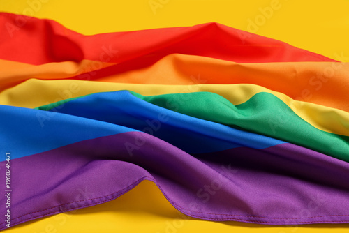 Rainbow flag on yellow back...