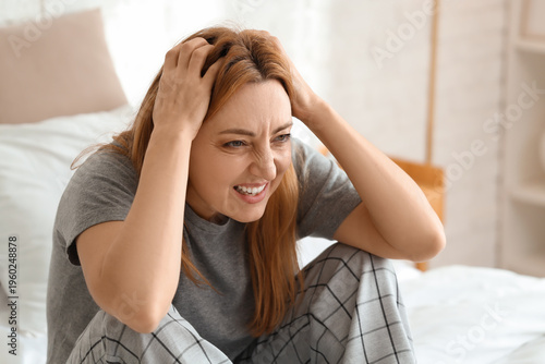 Angry mature woman sitting ...
