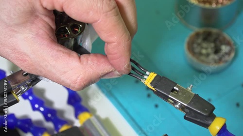 Soldering black motor wires to XT30 connector for drone assembly