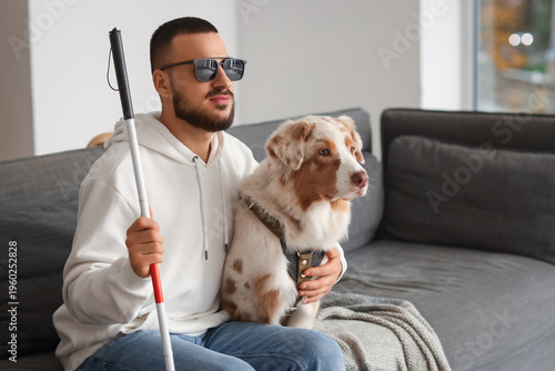 Blind young man with stick ...