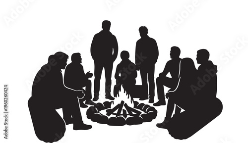 Group of people gathered around a campfire in silhouette enjoying a social outdoor moment together at night