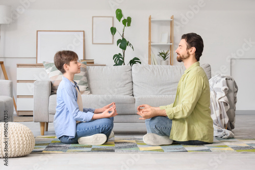 Father with his son meditat...